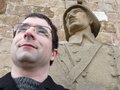 Me posing in front of statue at the Castle of MontjuÃ¯c
