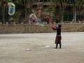 Someone performing at the centre of Park GÃ¼ell.