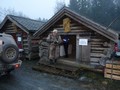 HÃ¥kon in front of Christmas cottage