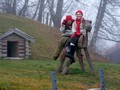 Girls riding a wooden horse at Christmas market