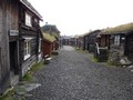 Street with turf-roofed timber buildings in RÃ¸ros